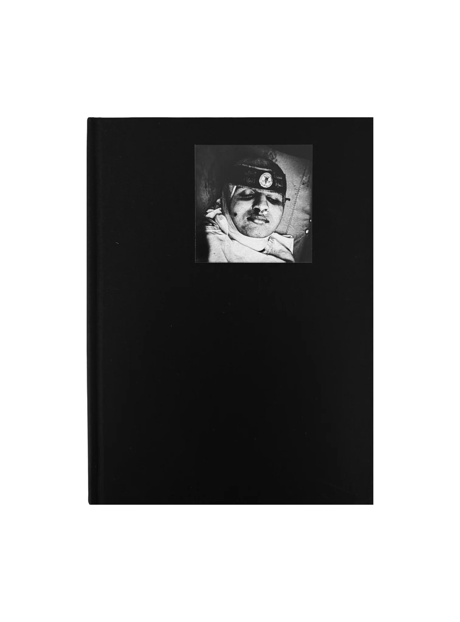 Black linen cover of Dying To Exist, with a small black and white portrait.